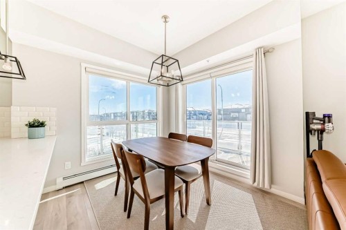 209-4250 Seton Drive Se, Calgary, AB - Indoor Photo Showing Dining Room