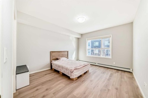 209-4250 Seton Drive Se, Calgary, AB - Indoor Photo Showing Bedroom