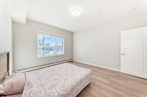 209-4250 Seton Drive Se, Calgary, AB - Indoor Photo Showing Bedroom