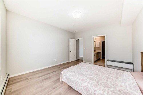 209-4250 Seton Drive Se, Calgary, AB - Indoor Photo Showing Bedroom