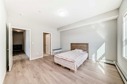 209-4250 Seton Drive Se, Calgary, AB - Indoor Photo Showing Bedroom