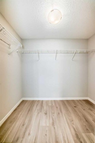 209-4250 Seton Drive Se, Calgary, AB - Indoor With Storage