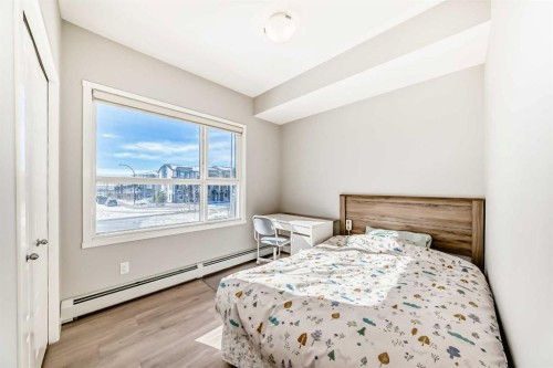 209-4250 Seton Drive Se, Calgary, AB - Indoor Photo Showing Bedroom