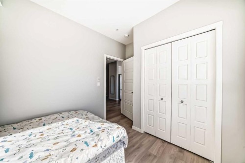 209-4250 Seton Drive Se, Calgary, AB - Indoor Photo Showing Bedroom