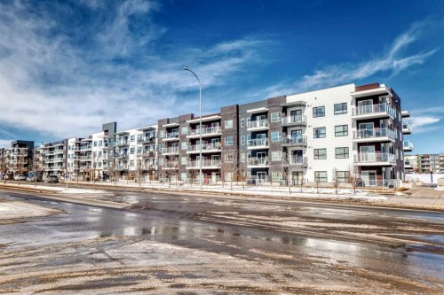 209-4250 Seton Drive Se, Calgary, AB - Outdoor With Balcony With Facade