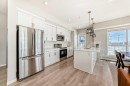 209-4250 Seton Drive Se, Calgary, AB  - Indoor Photo Showing Kitchen With Stainless Steel Kitchen With Upgraded Kitchen 