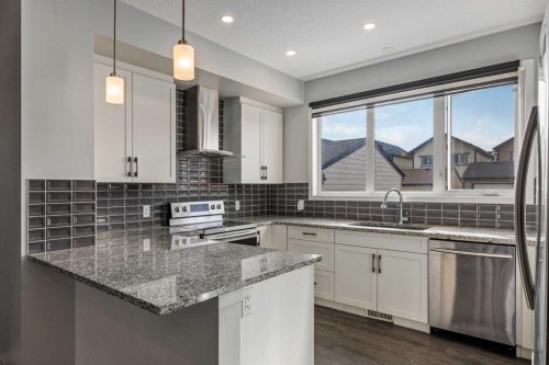 77 Masters Street Se, Calgary, AB - Indoor Photo Showing Kitchen With Upgraded Kitchen