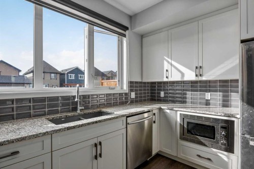 77 Masters Street Se, Calgary, AB - Indoor Photo Showing Kitchen With Upgraded Kitchen