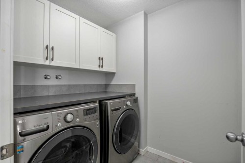 77 Masters Street Se, Calgary, AB - Indoor Photo Showing Laundry Room