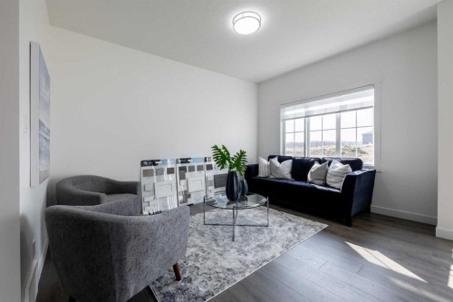 48 Heritage Manor, Cochrane, AB - Indoor Photo Showing Living Room