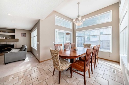 3767 Springbank Drive Sw, Calgary, AB - Indoor Photo Showing Dining Room With Fireplace