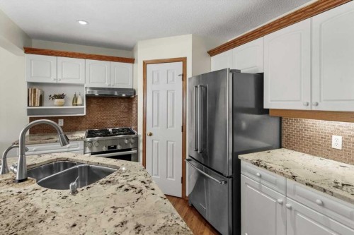 31 River Rock Manor Se, Calgary, AB - Indoor Photo Showing Kitchen With Stainless Steel Kitchen With Double Sink