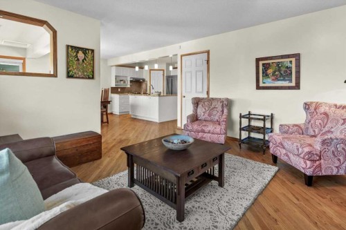 31 River Rock Manor Se, Calgary, AB - Indoor Photo Showing Living Room
