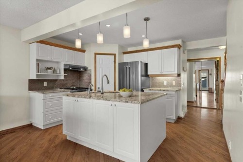 31 River Rock Manor Se, Calgary, AB - Indoor Photo Showing Kitchen With Stainless Steel Kitchen With Upgraded Kitchen