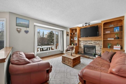 108 Hawkstone Close Nw, Calgary, AB - Indoor Photo Showing Living Room With Fireplace