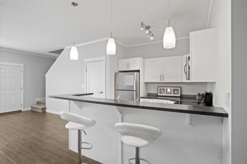 100-351 Monteith Drive Se, High River, AB - Indoor Photo Showing Kitchen