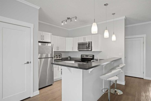 100-351 Monteith Drive Se, High River, AB - Indoor Photo Showing Kitchen With Upgraded Kitchen