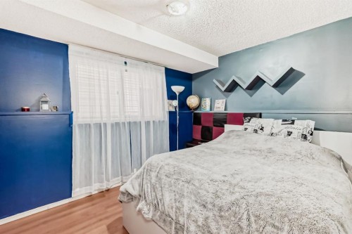 17007 Sunvale Road Se, Calgary, AB - Indoor Photo Showing Bedroom