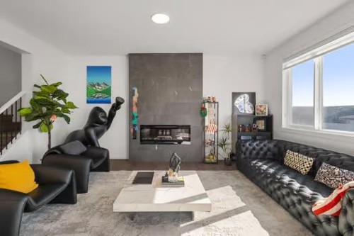 75 Royston Heath Nw, Calgary, AB - Indoor Photo Showing Living Room With Fireplace