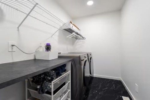 75 Royston Heath Nw, Calgary, AB - Indoor Photo Showing Laundry Room