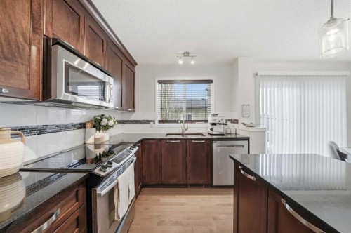 189 Elgin Meadows Park Se, Calgary, AB - Indoor Photo Showing Kitchen With Double Sink With Upgraded Kitchen