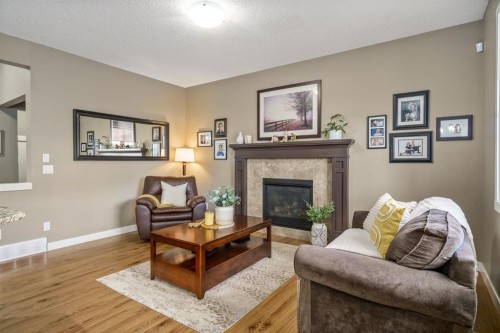 109 Ranch Rise, Strathmore, AB - Indoor Photo Showing Living Room With Fireplace