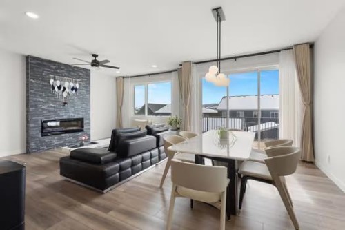 67 Royston Heath Nw, Calgary, AB - Indoor With Fireplace