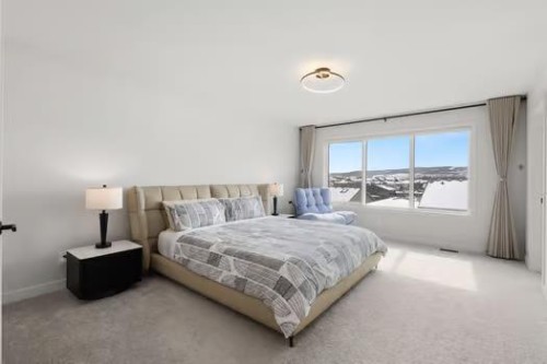 67 Royston Heath Nw, Calgary, AB - Indoor Photo Showing Bedroom