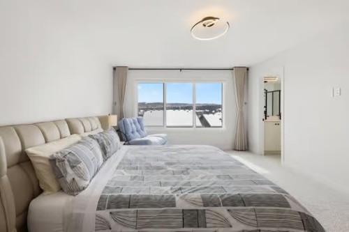 67 Royston Heath Nw, Calgary, AB - Indoor Photo Showing Bedroom