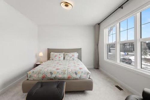 67 Royston Heath Nw, Calgary, AB - Indoor Photo Showing Bedroom
