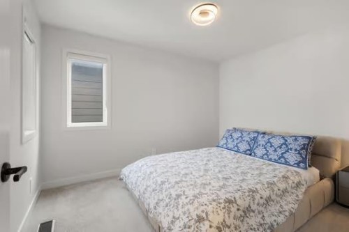 67 Royston Heath Nw, Calgary, AB - Indoor Photo Showing Bedroom