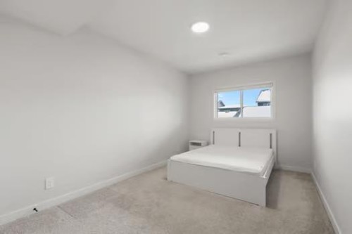 67 Royston Heath Nw, Calgary, AB - Indoor Photo Showing Bedroom