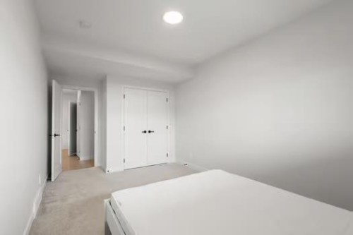 67 Royston Heath Nw, Calgary, AB - Indoor Photo Showing Bedroom