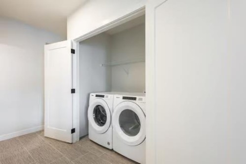 67 Royston Heath Nw, Calgary, AB - Indoor Photo Showing Laundry Room