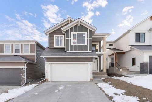 303 Rivercrest Way, Cochrane, AB - Outdoor With Facade