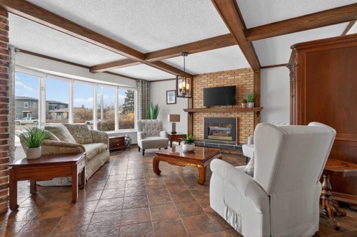 19 Beaupre Crescent Nw, Calgary, AB - Indoor Photo Showing Living Room With Fireplace