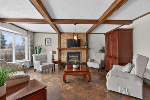 19 Beaupre Crescent Nw, Calgary, AB - Indoor Photo Showing Living Room With Fireplace