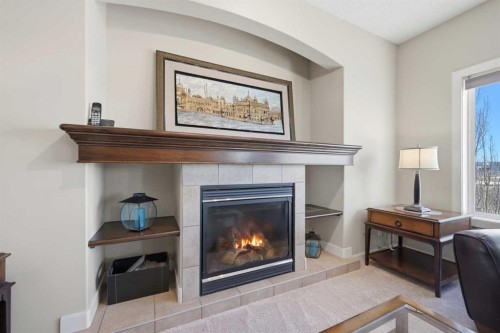 212 Springmere Road, Chestermere, AB - Indoor Photo Showing Living Room With Fireplace