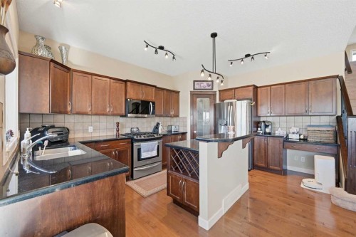 212 Springmere Road, Chestermere, AB - Indoor Photo Showing Kitchen With Double Sink With Upgraded Kitchen