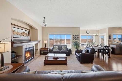 212 Springmere Road, Chestermere, AB - Indoor Photo Showing Living Room With Fireplace