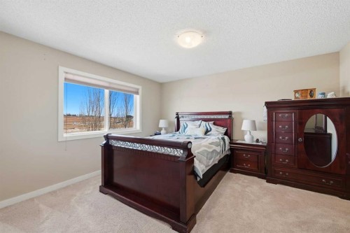 212 Springmere Road, Chestermere, AB - Indoor Photo Showing Bedroom