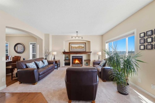 212 Springmere Road, Chestermere, AB - Indoor Photo Showing Living Room With Fireplace