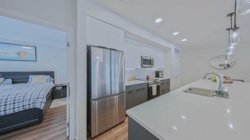 2209-33 Carringham Gate Nw, Calgary, AB - Indoor Photo Showing Kitchen With Upgraded Kitchen