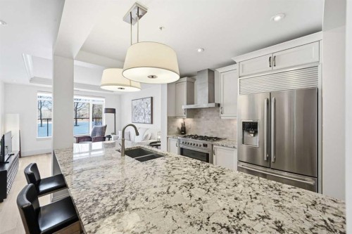 101-121 Quarry Way Se, Calgary, AB - Indoor Photo Showing Kitchen With Stainless Steel Kitchen With Double Sink With Upgraded Kitchen