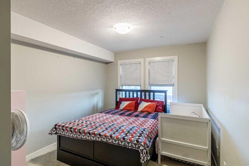 302-2300 Evanston Square Nw, Calgary, AB - Indoor Photo Showing Bedroom