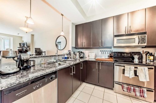 204-830 Centre Avenue Ne, Calgary, AB - Indoor Photo Showing Kitchen With Double Sink