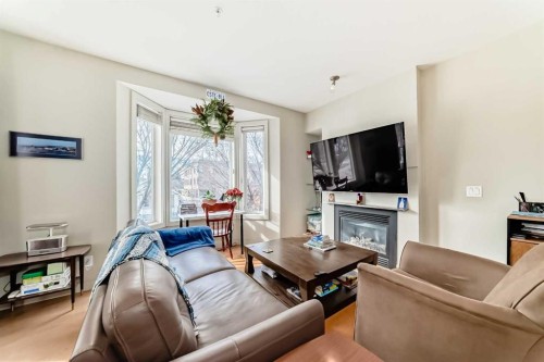 204-830 Centre Avenue Ne, Calgary, AB - Indoor Photo Showing Living Room With Fireplace
