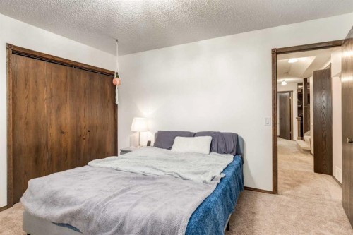 76 Sunmount Road Se, Calgary, AB - Indoor Photo Showing Bedroom