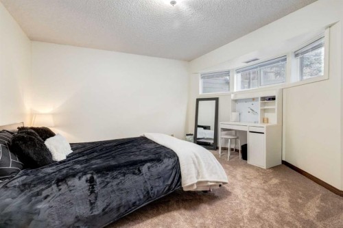 76 Sunmount Road Se, Calgary, AB - Indoor Photo Showing Bedroom