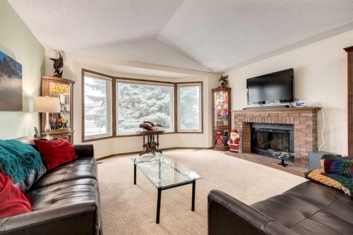 76 Sunmount Road Se, Calgary, AB - Indoor Photo Showing Living Room With Fireplace